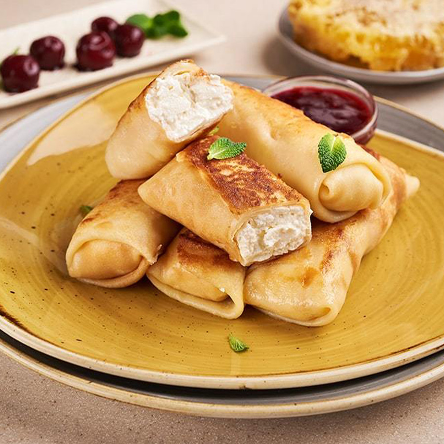млинці з солодким сиром